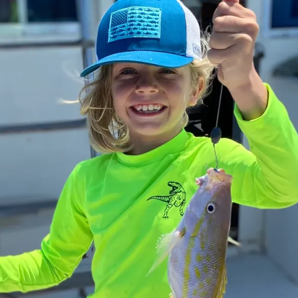a child holding a fish